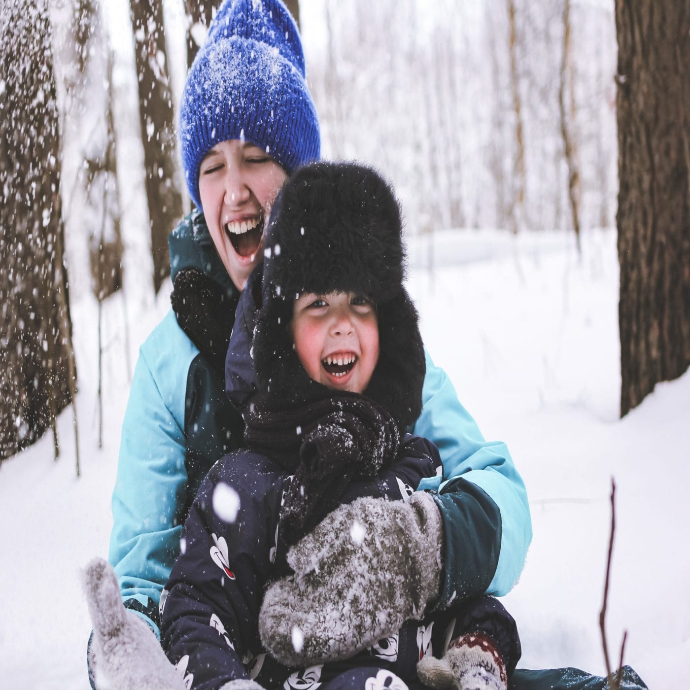 Wintry mix: How to handle work + kids on snow days Mom and child in the snow day