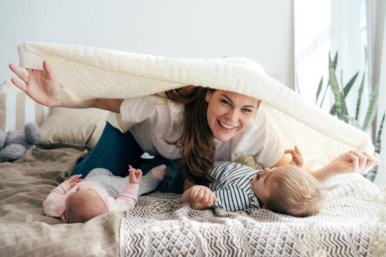 Motherhood is life-changing but that doesn’t mean you need to disappear mom playing with kids