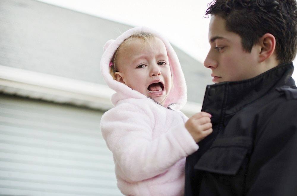 15 positive ways to help your child learn to manage their anger dad holding a screaming toddler