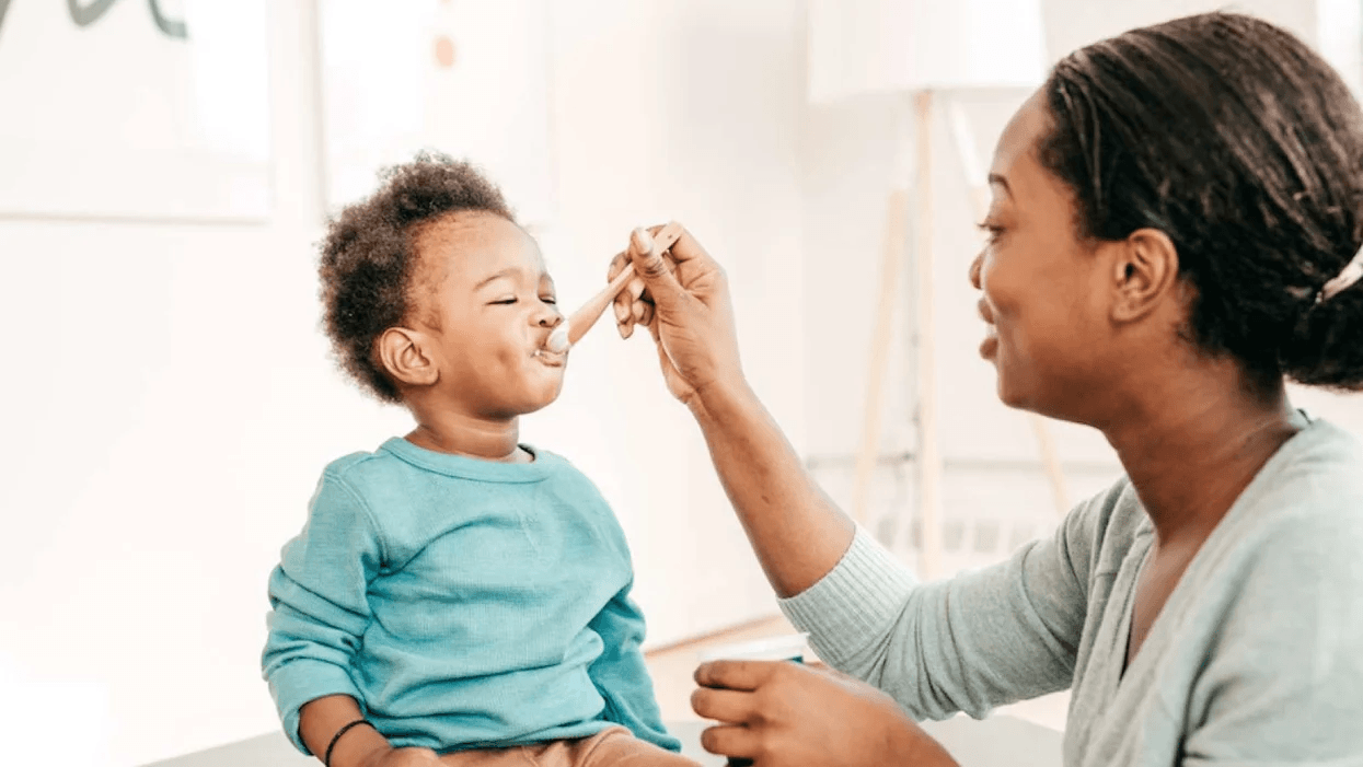 Yogurt reduces baby’s risk of developing allergies and eczema, say researchers mom feeding toddler yogurt