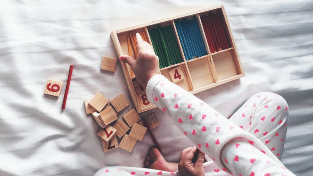 9 Montessori-friendly toys you can get at Walmart toddler playing with montessori toys