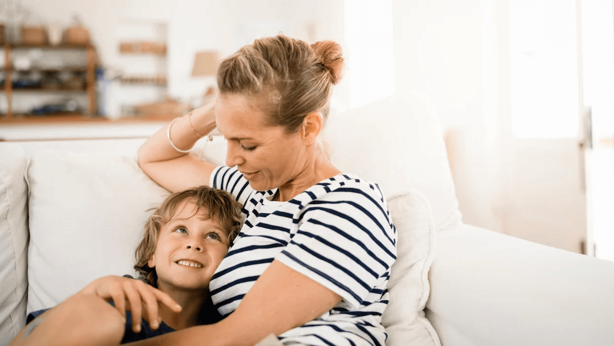 The way we talk to our children becomes part of their conscience for years to come mom and son snuggling on the couch
