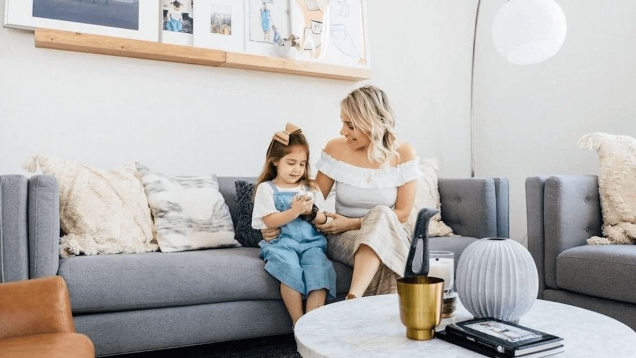 13 realistic ways to transition to peaceful parenting mom talking to daughter on the couch