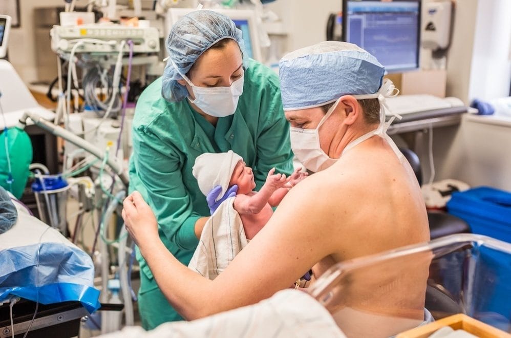 Viral pictures show dad doing skin-to-skin with his twin babies for a very good reason