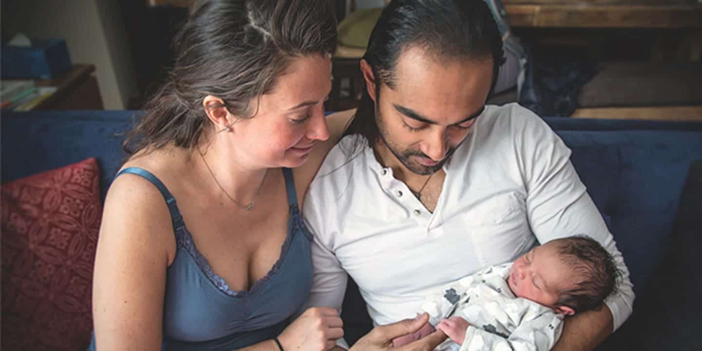 5 Tips to babyproof your relationship man and woman looking at a baby