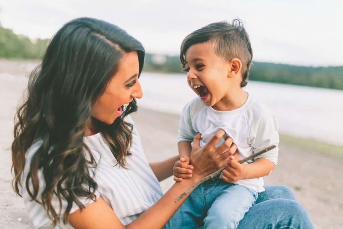 Why you need to sing your own praises in front of your children, mama mom tickling her child