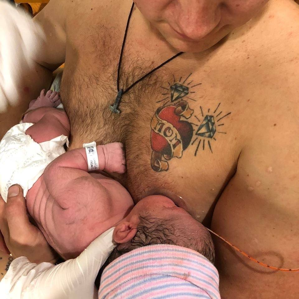 Dad goes viral for ‘breastfeeding’ while mama recovered from C-section Bare Chested Man holding a new born baby