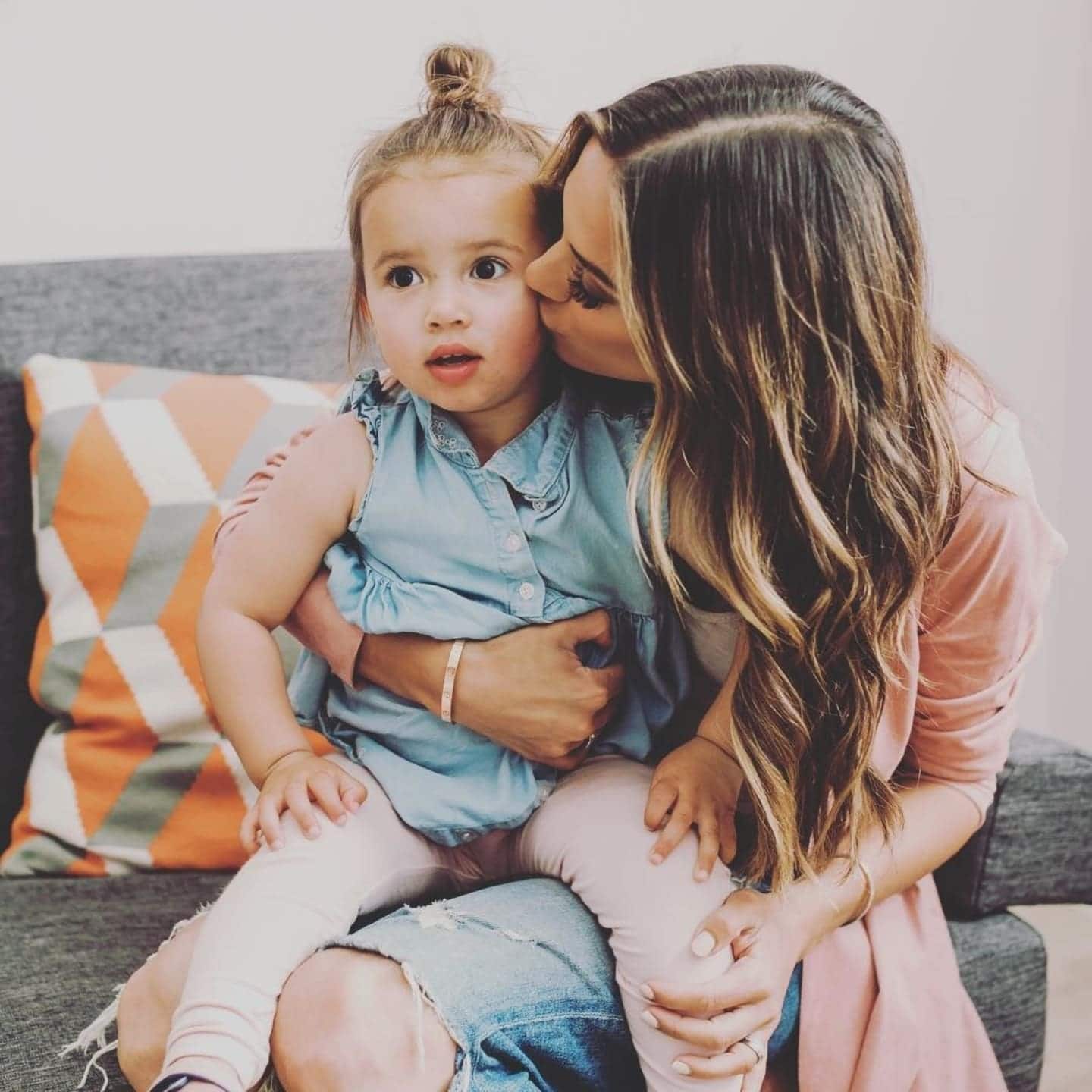 Jana Kramer is expecting a rainbow baby after multiple losses mom kissing daughter's cheek