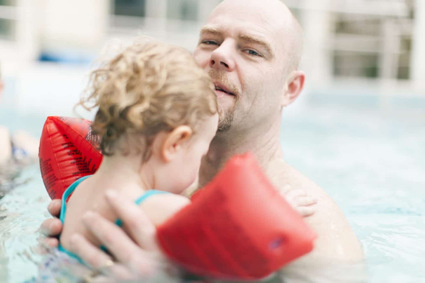This viral video proves why pool safety with kids require layers of protection man carrying his child in a pool