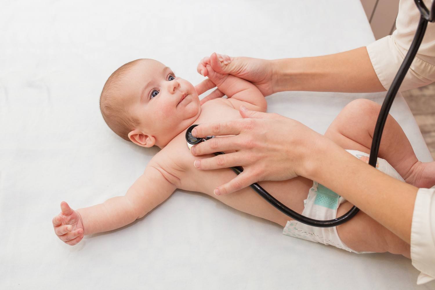 AAP: Parents should meet pediatrician *before* baby is born doctor checking baby's heartbeat