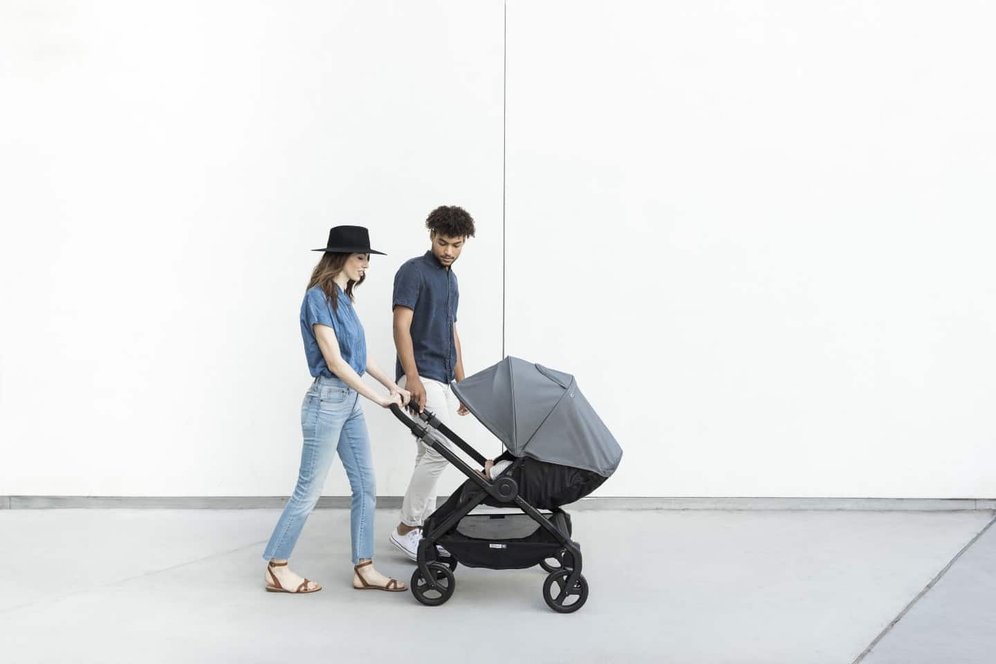 Attachment parenting in the 4th-trimester: An easy guide for new parents man and woman pushing a stroller