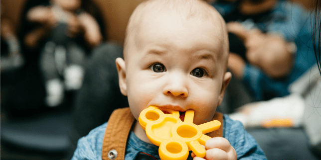 What NOT to Do When Your Baby is Teething baby chewing on teething toy