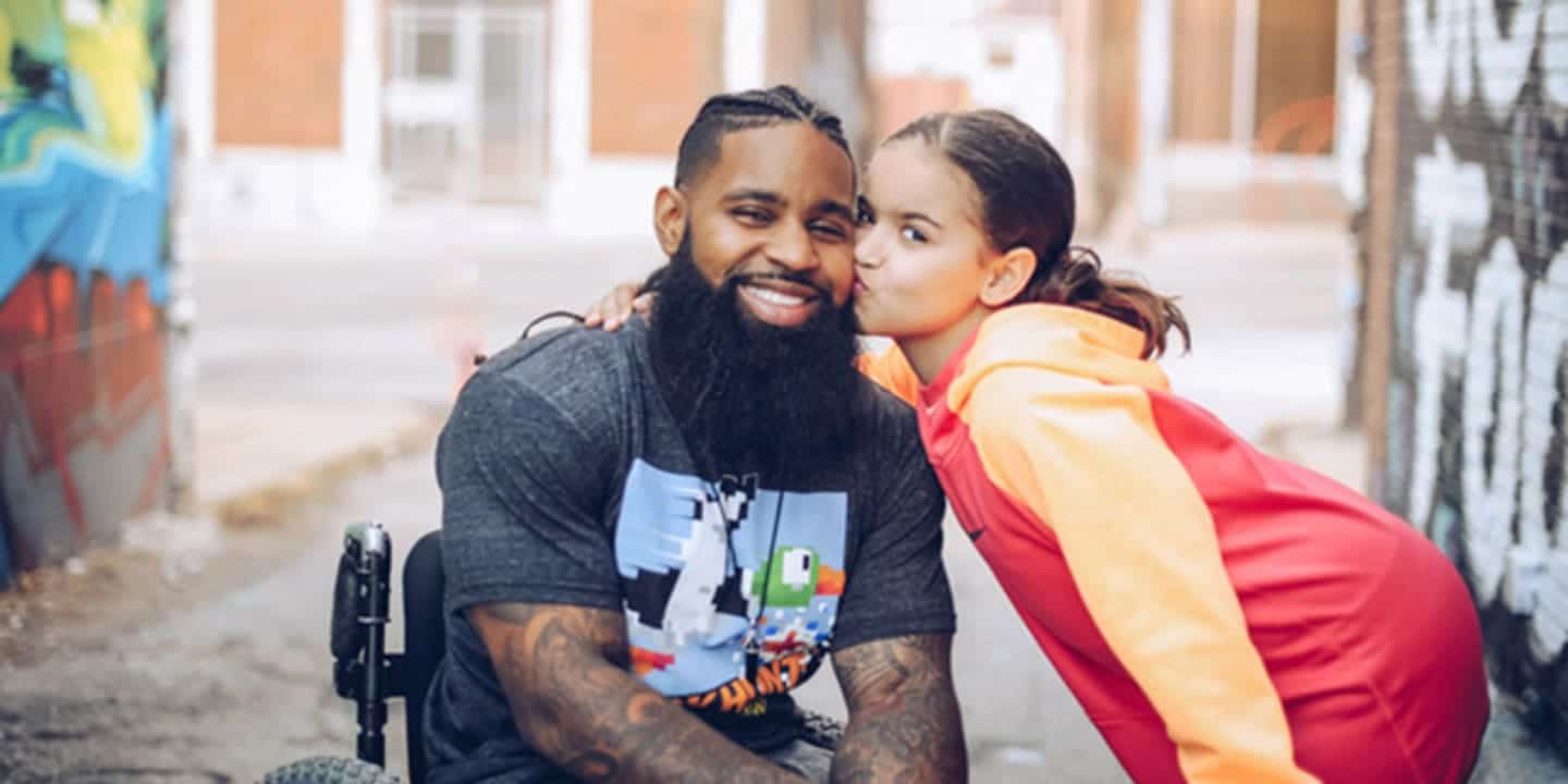 5 Things this dad wants you to know about parenting with a disability child kissing her father on the cheek