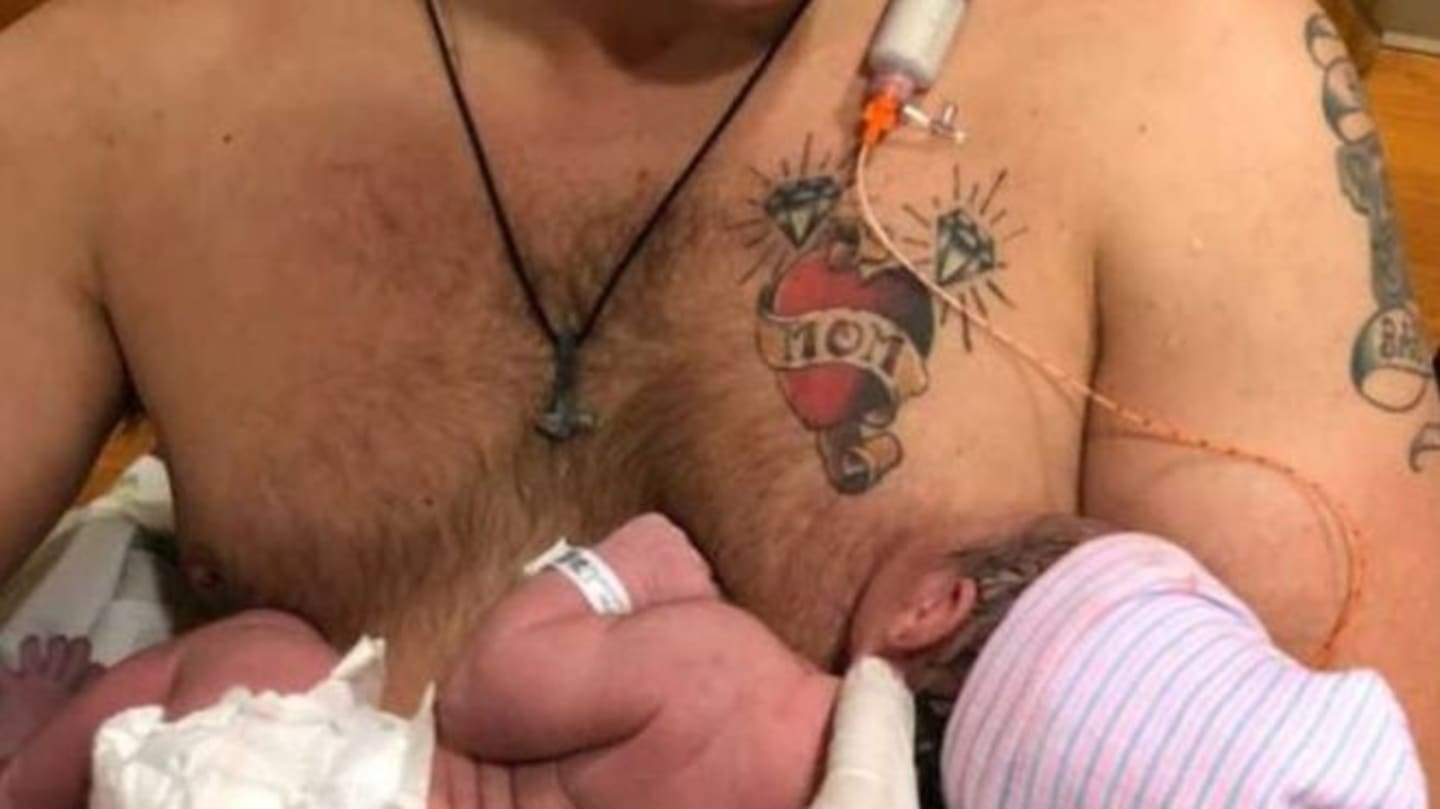 This dad is ‘breastfeeding’ his newborn daughter man breastfeeding newborn child