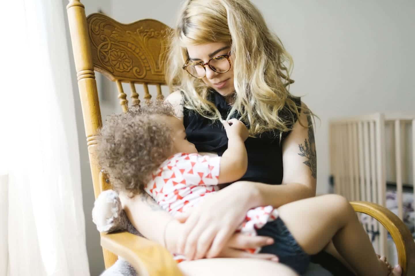 The breastfeeding policy debate proves one thing: ALL parents need more support around nourishing their children mom carrying her child
