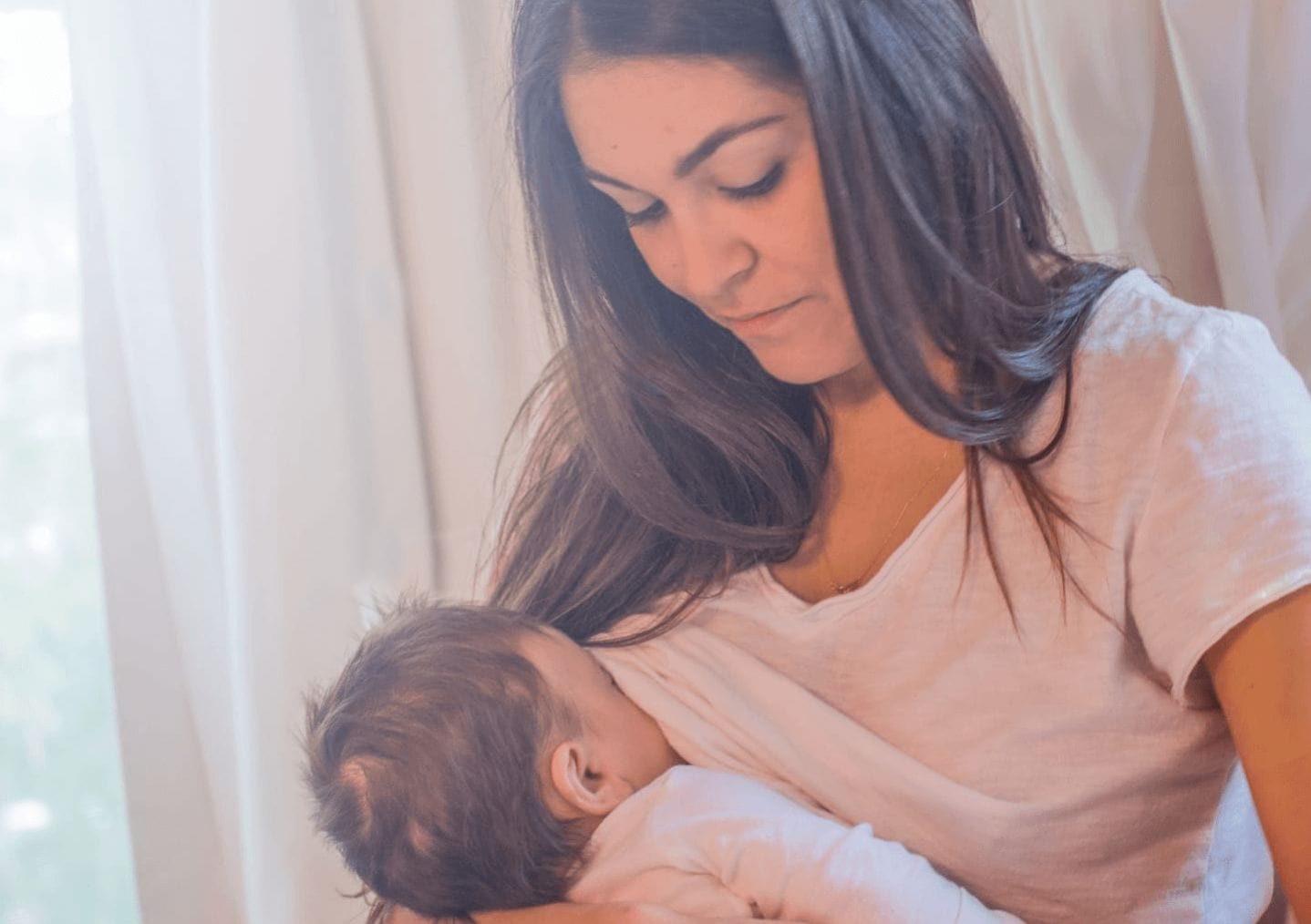 True life: There was SO much about breastfeeding I didn’t know woman breastfeeding baby under her shirt- what I didn't know about breastfeeding