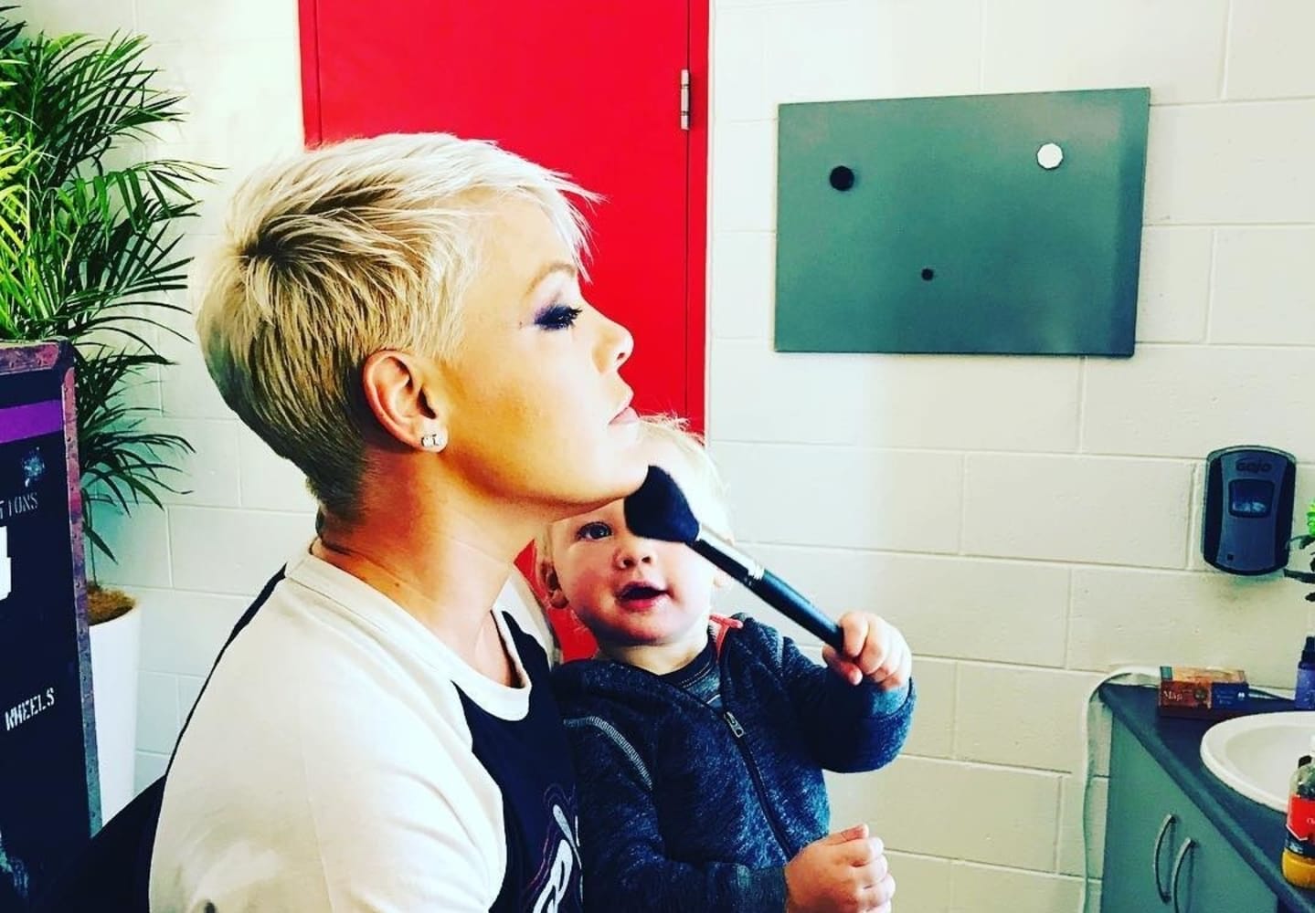 Moms don’t get sick days—and Pink is just one example of that Pink with her son