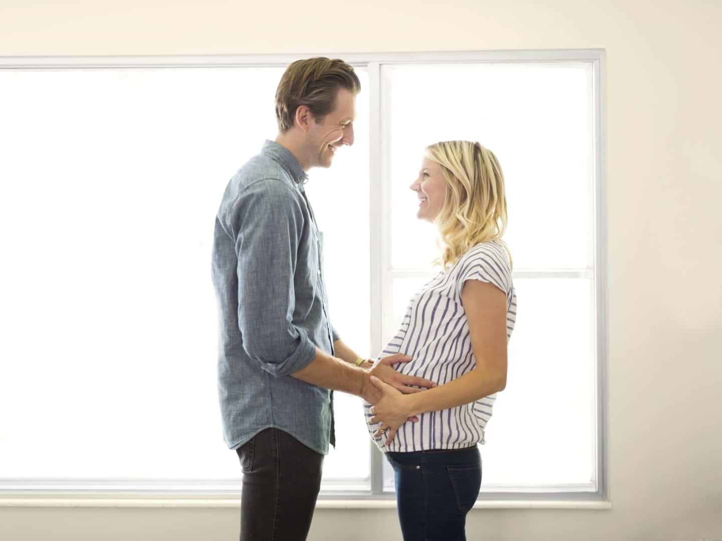 Pregnancy is hard—but also so life-changing I wish you could experience it too man and woman standing