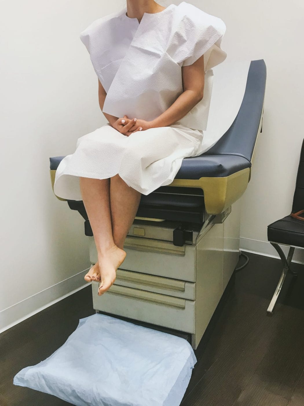 This test may help find the cause of many miscarriages woman sitting in an examination chair