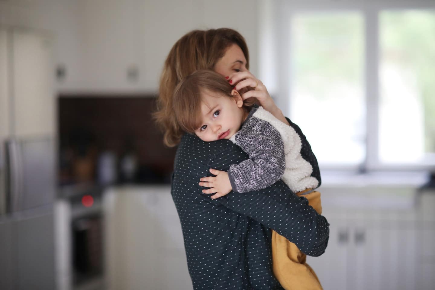 Attachment parenting is not the same as having a secure attachment—here’s why woman carrying her child