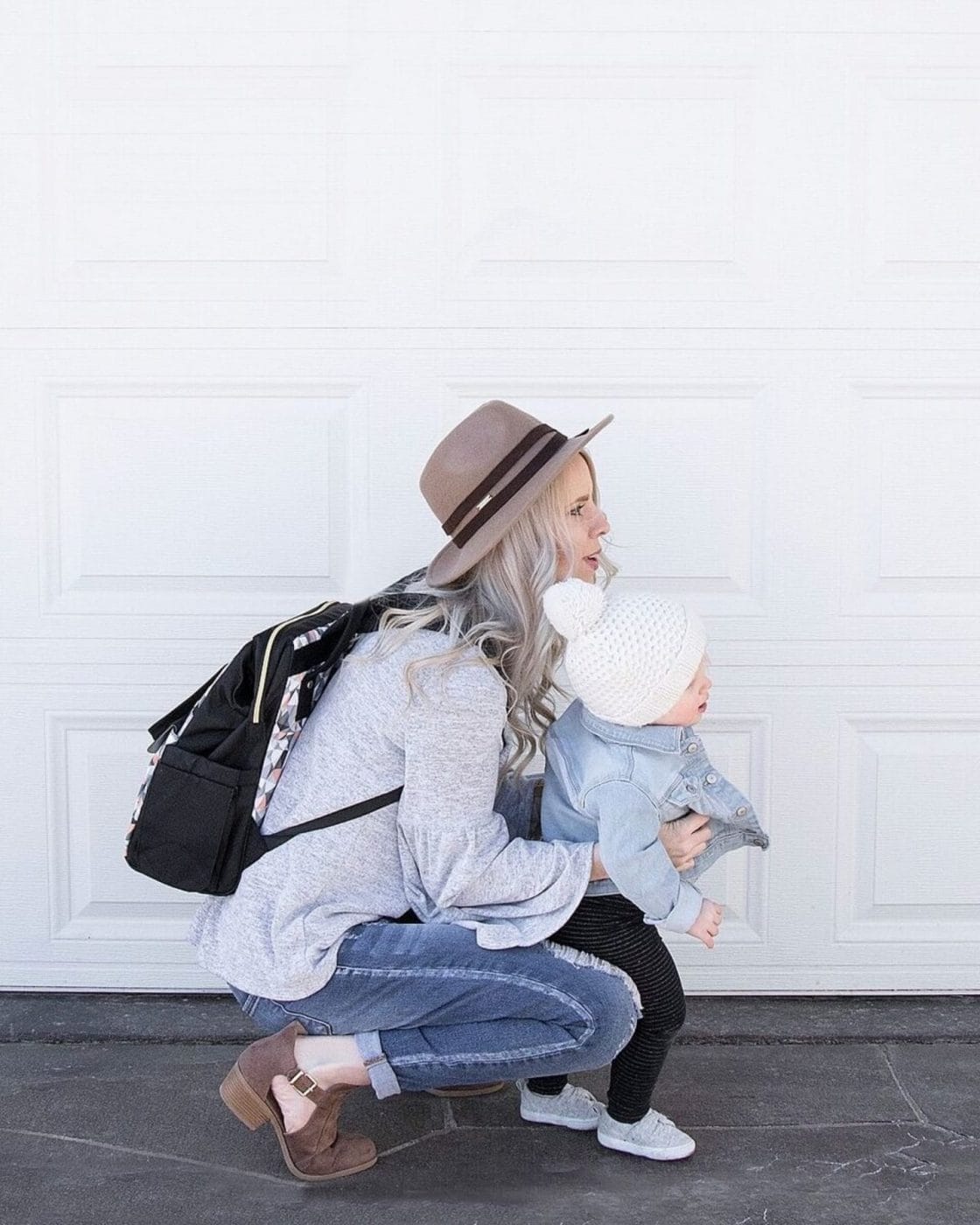 The cost of daycare is almost as much as rent in some cities mom hugging child