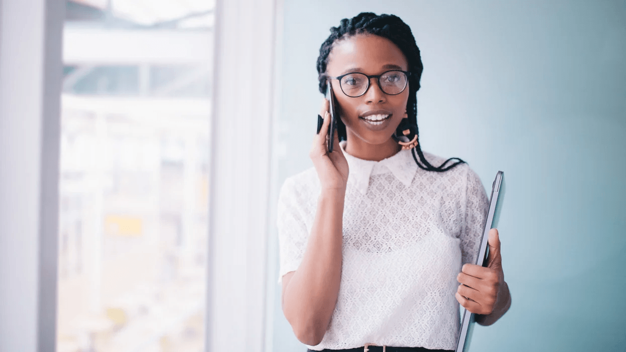 Going back to work after maternity leave hurts—but these 5 things made it a little easier woman talking on the phone