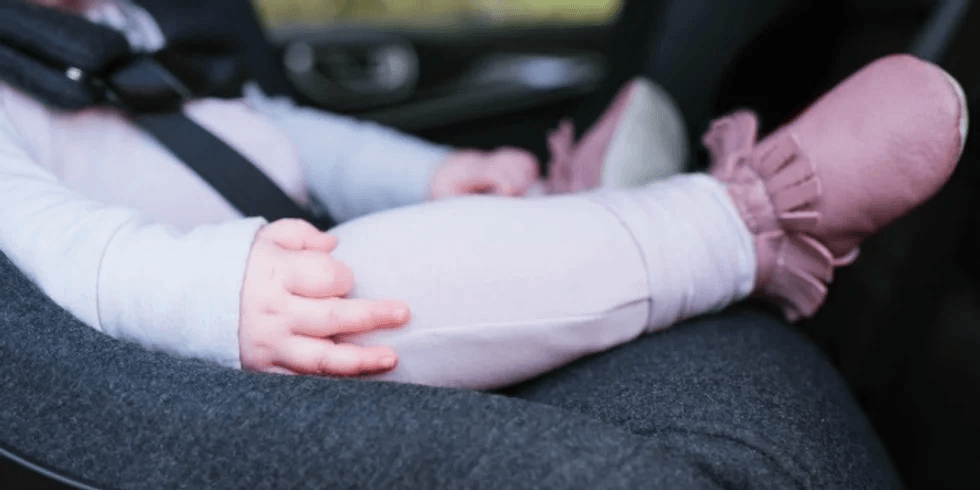 The New AAP Car Seat Guidelines You Need to Know About closeup of baby in a car seat