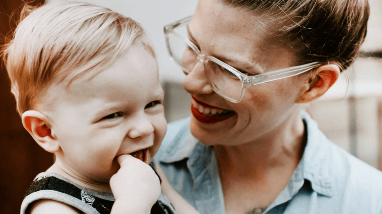 I’m not going “backwards” by choosing to stay home with my kids mom smiling at little boy