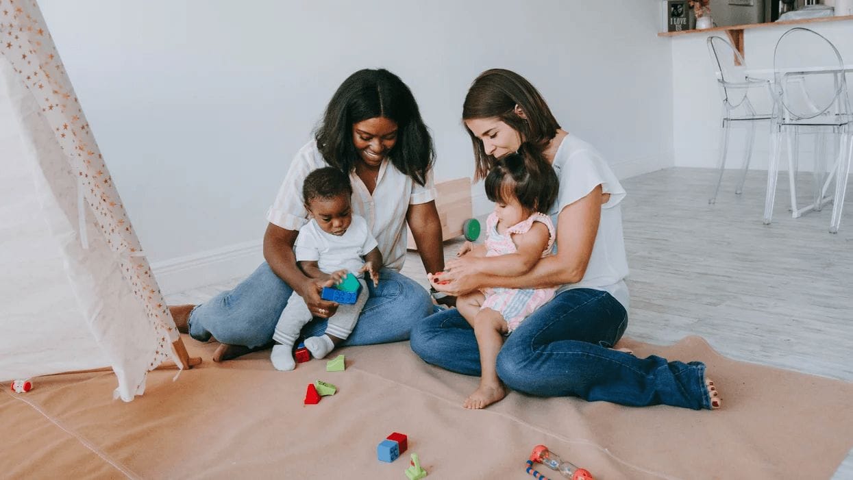 two moms having a baby play date