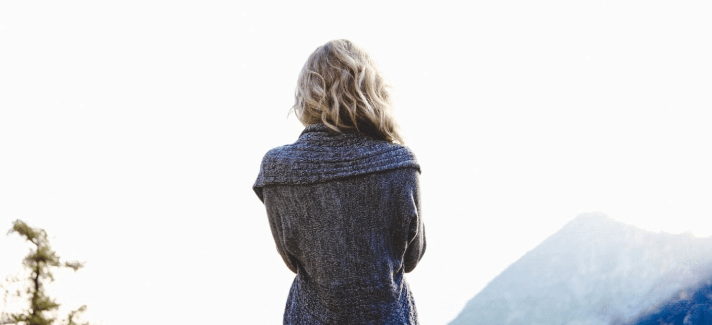 How I’m learning to mother–without my mom woman overlooking mountains