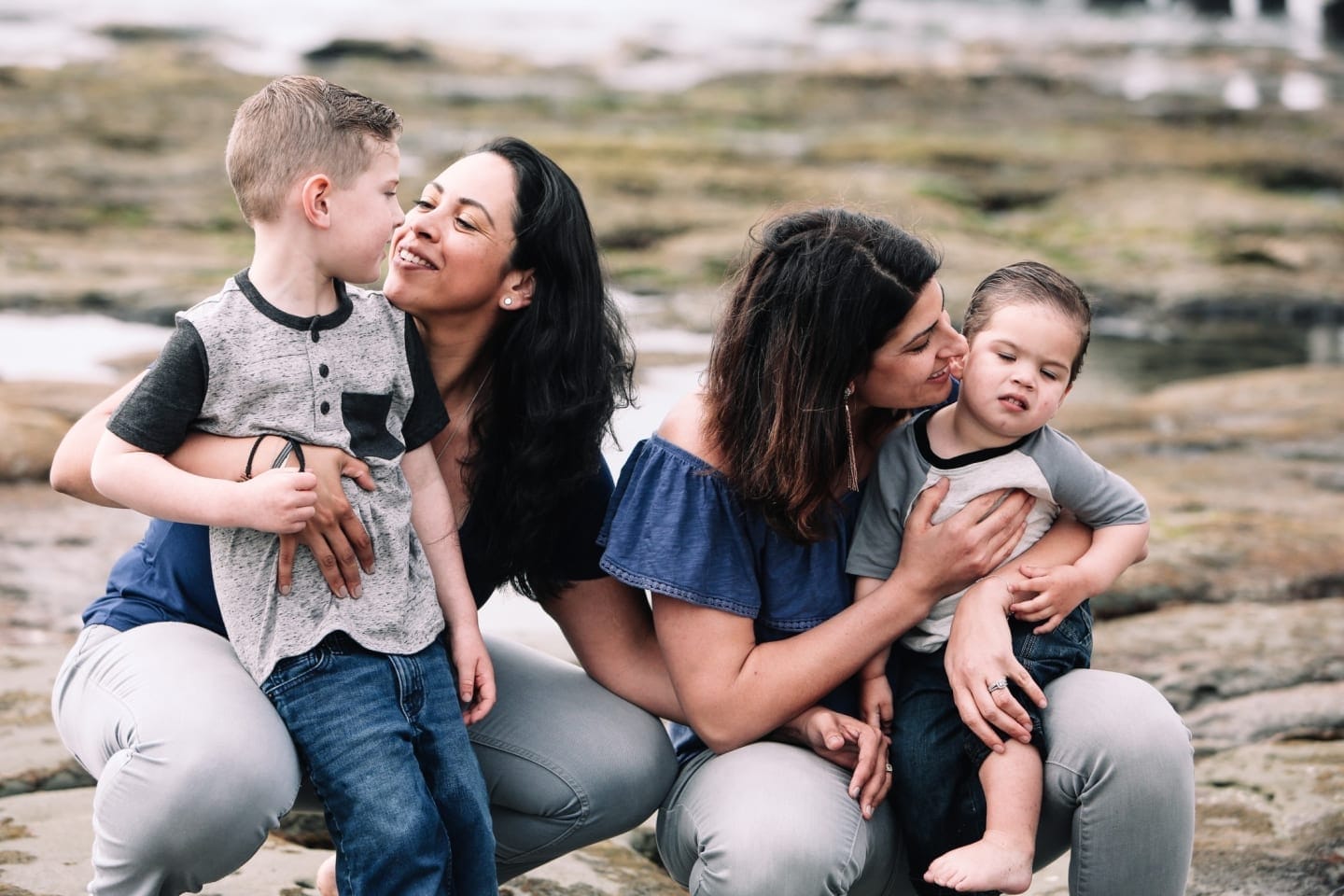 I didn’t give birth to my boys, but I am definitely their mom two moms hugging their kids