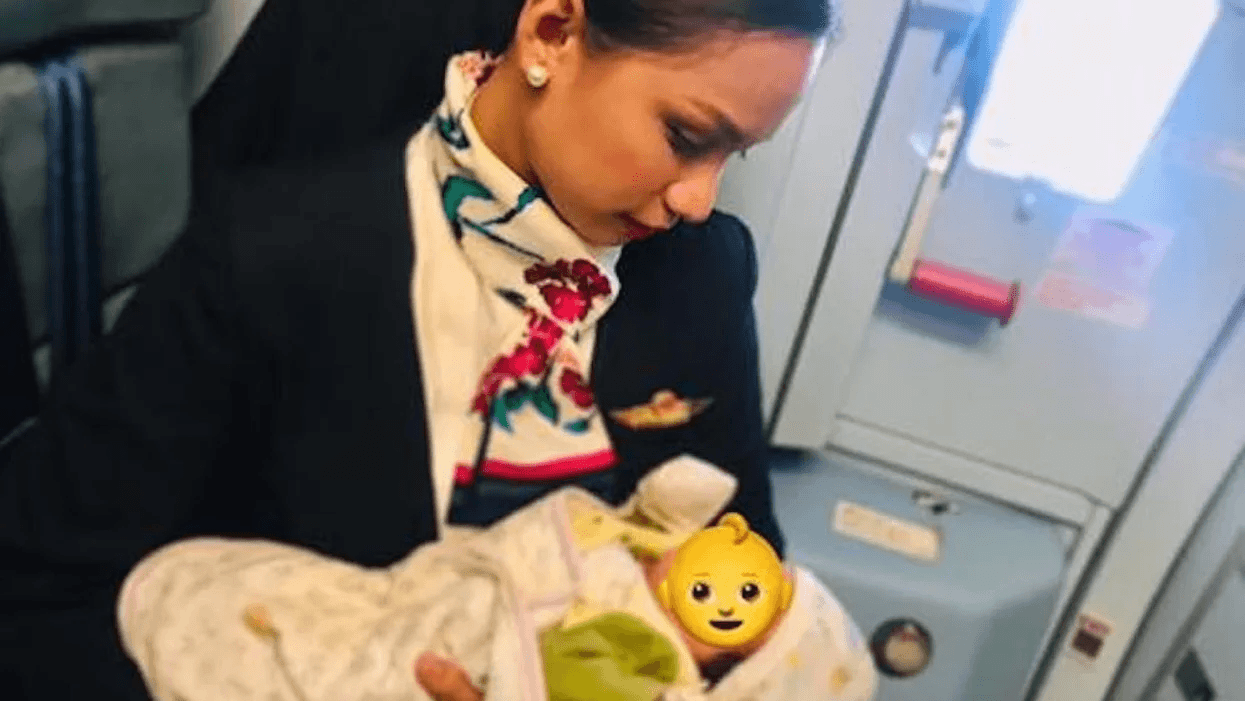 This flight attendant who breastfed a passenger’s hungry baby is still our hero flight-attendant-holding-baby