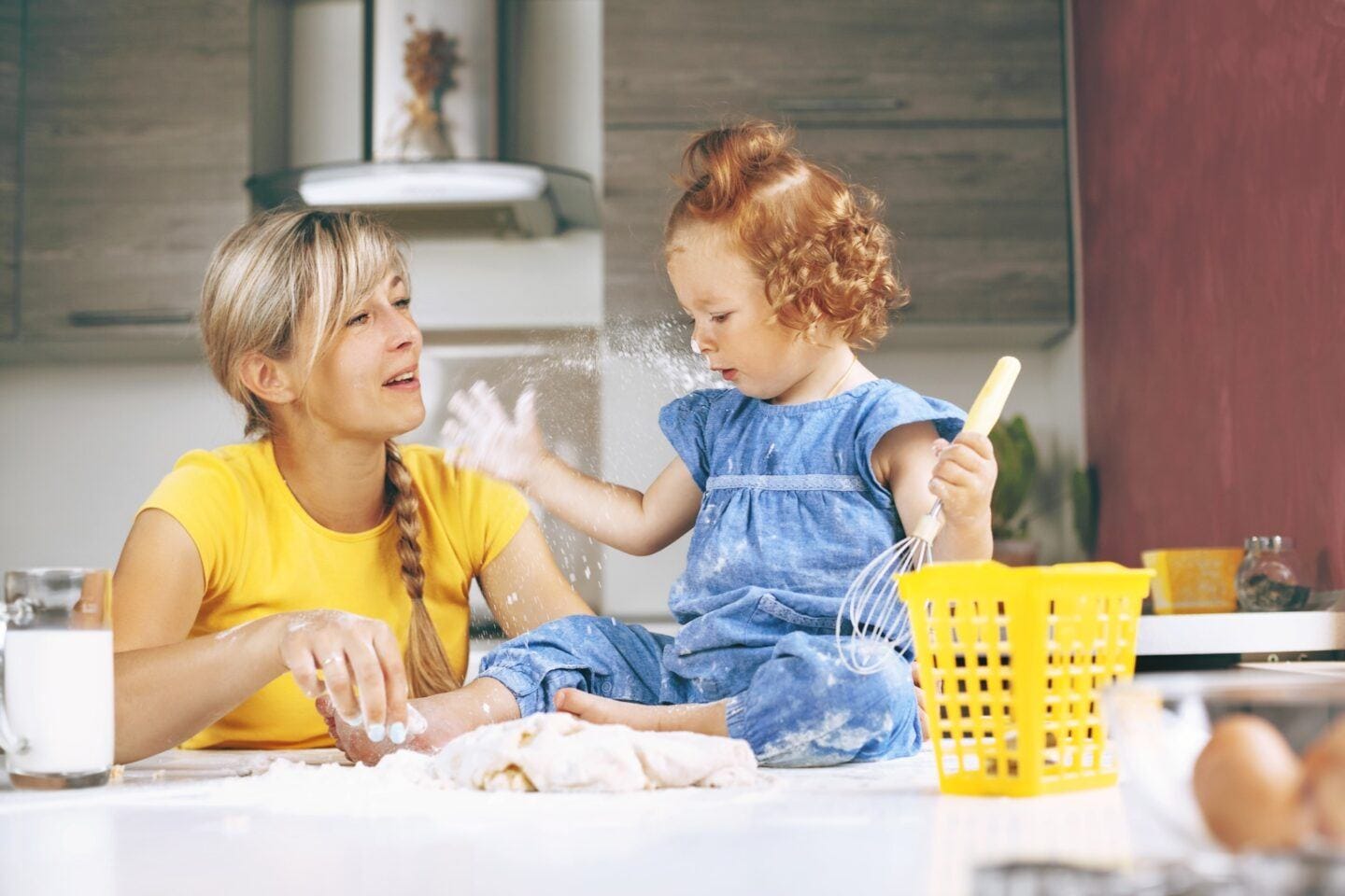 To help your child be a leader, let them play mom and daughter playing in the kitchen