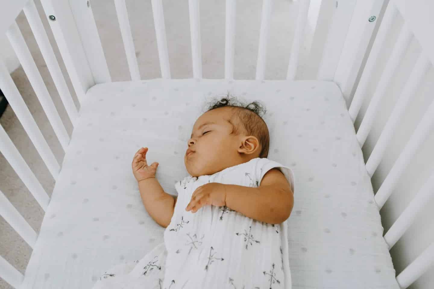 10 crucial habits that help baby (and parents!) get better sleep baby sleeping in a crib
