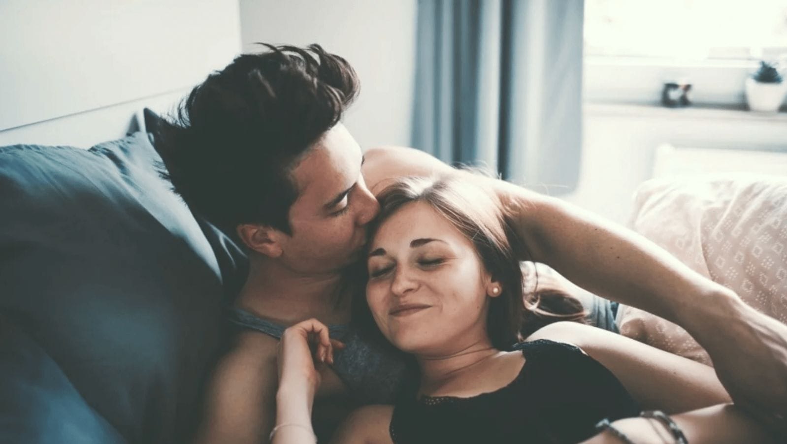 Let’s make a baby: My 10-step plan to get pregnant partners laying on the couch holding each other