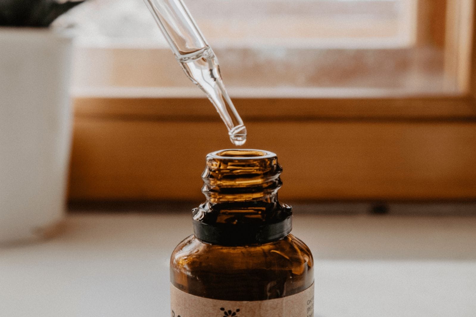 27 pregnancy safe skin care picks bottle of face serum
