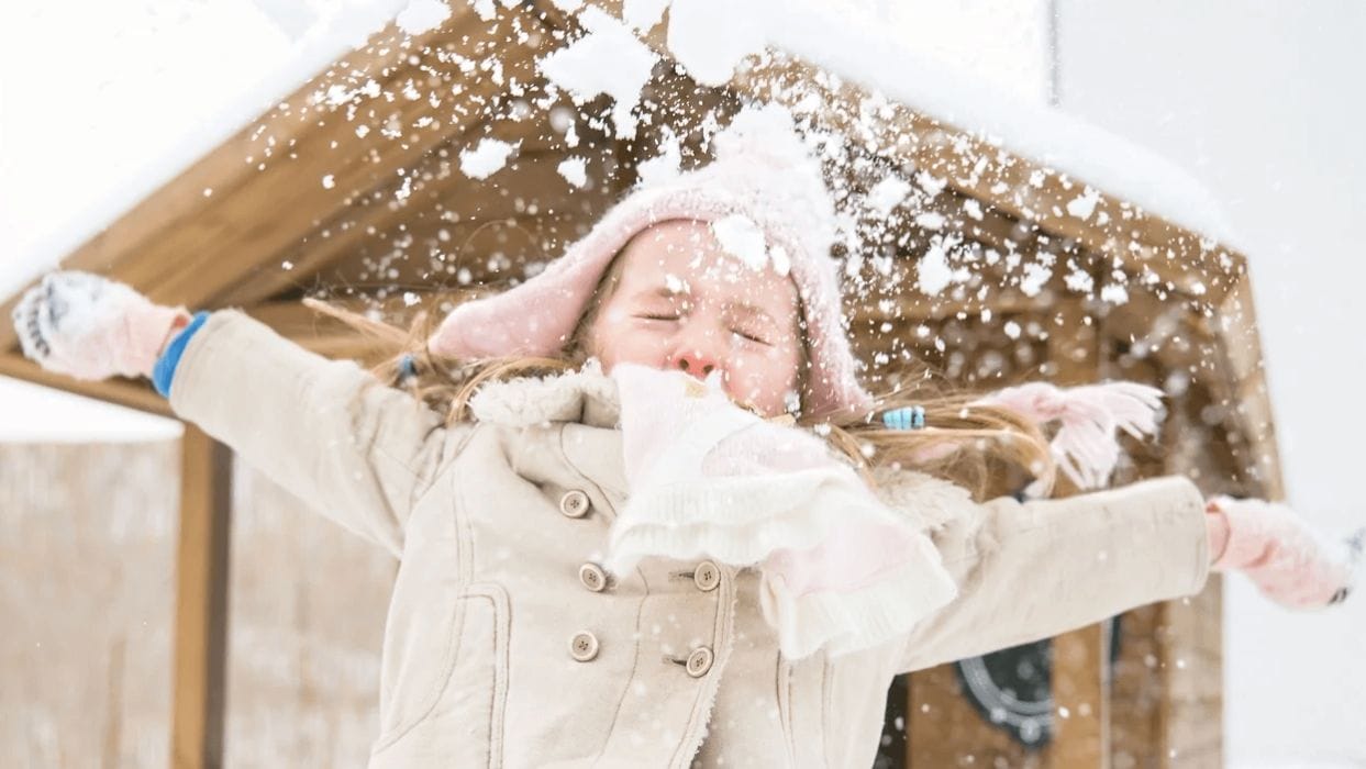 The joyful, illiterate kindergartners of Finland little girl playing in the snow
