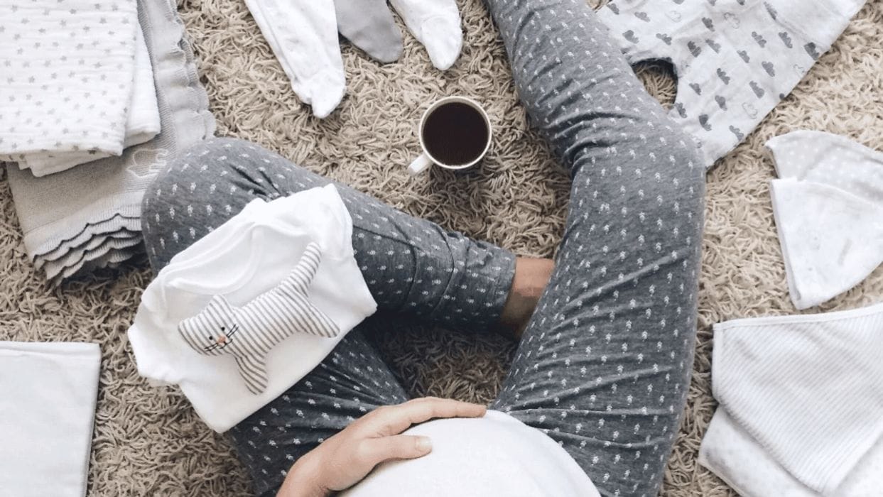 To the moms who gave my kids their hand-me-downs—thank you pregnant mom holding belly