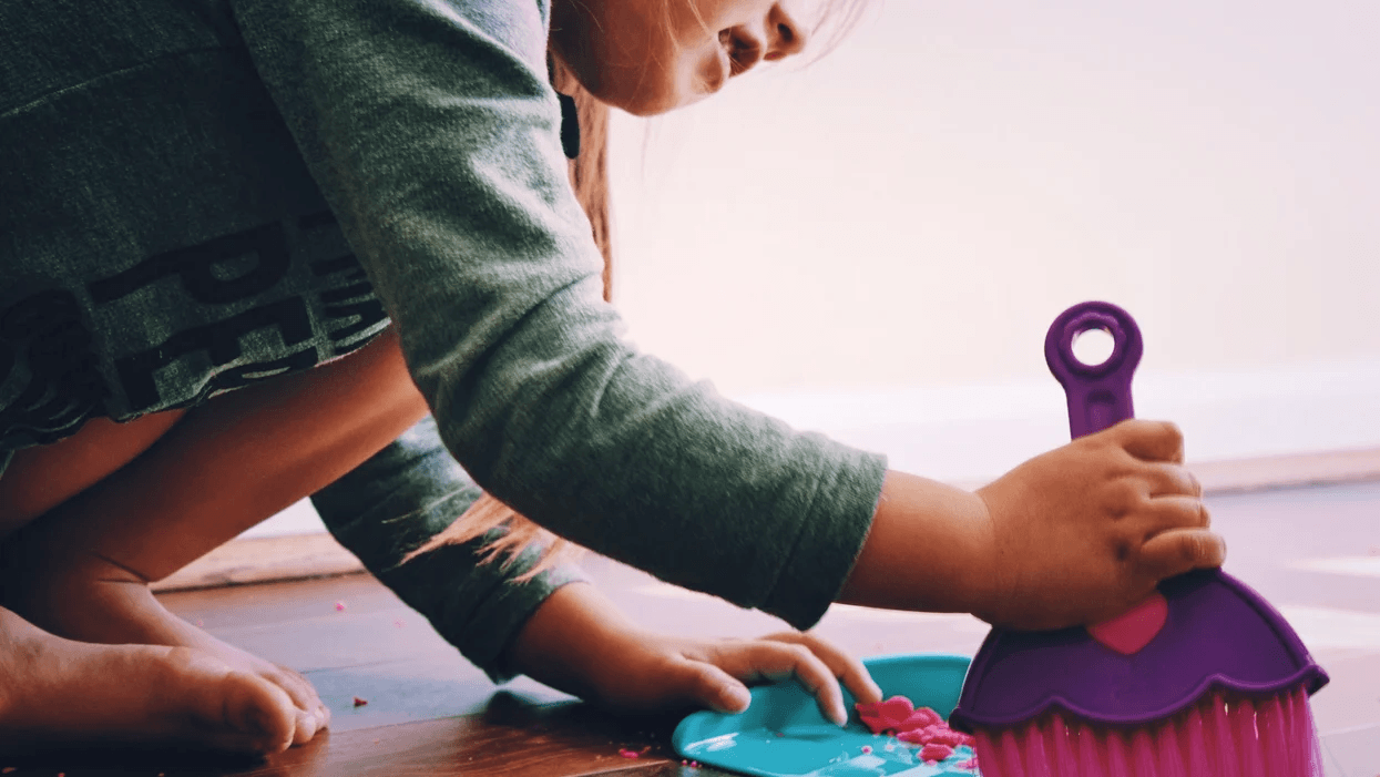 10 Montessori-inspired ways your toddler can help around the house toddler sweeping the floor