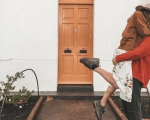 woman swept off feet kissing couple great sex life after kids - Motherly