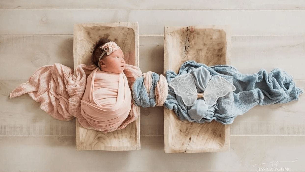 This viral newborn photo honors loss in such a beautiful and powerful way swaddled baby laying next to empty cloth