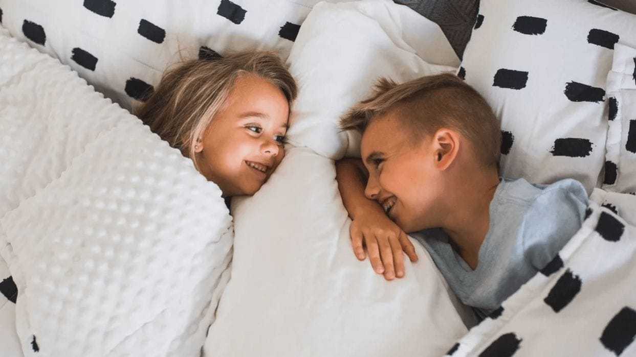 Is this viral bedtime chart realistic for most parents? siblings giggling in bed