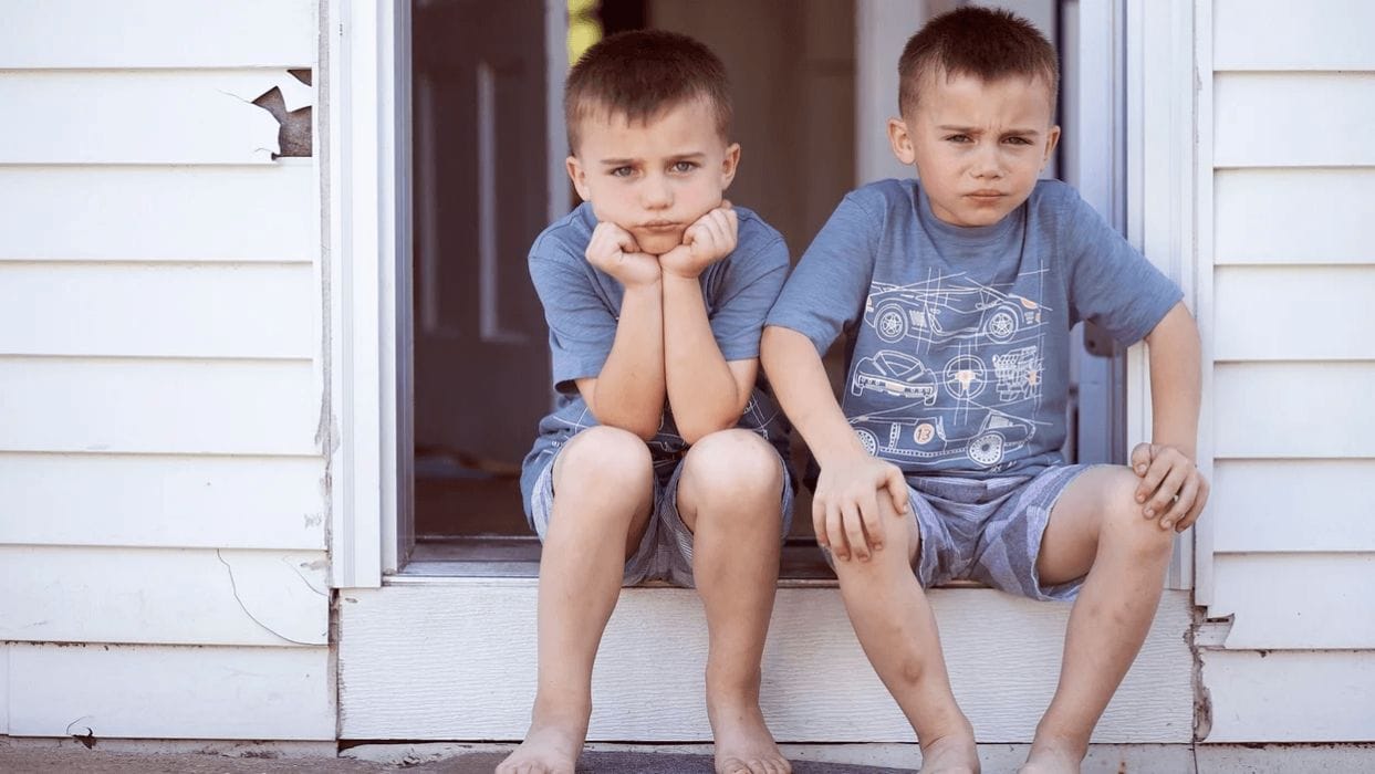 10 Montessori-inspired phrases to use when your child is being ‘mean’ twin boys sitting outside the front door
