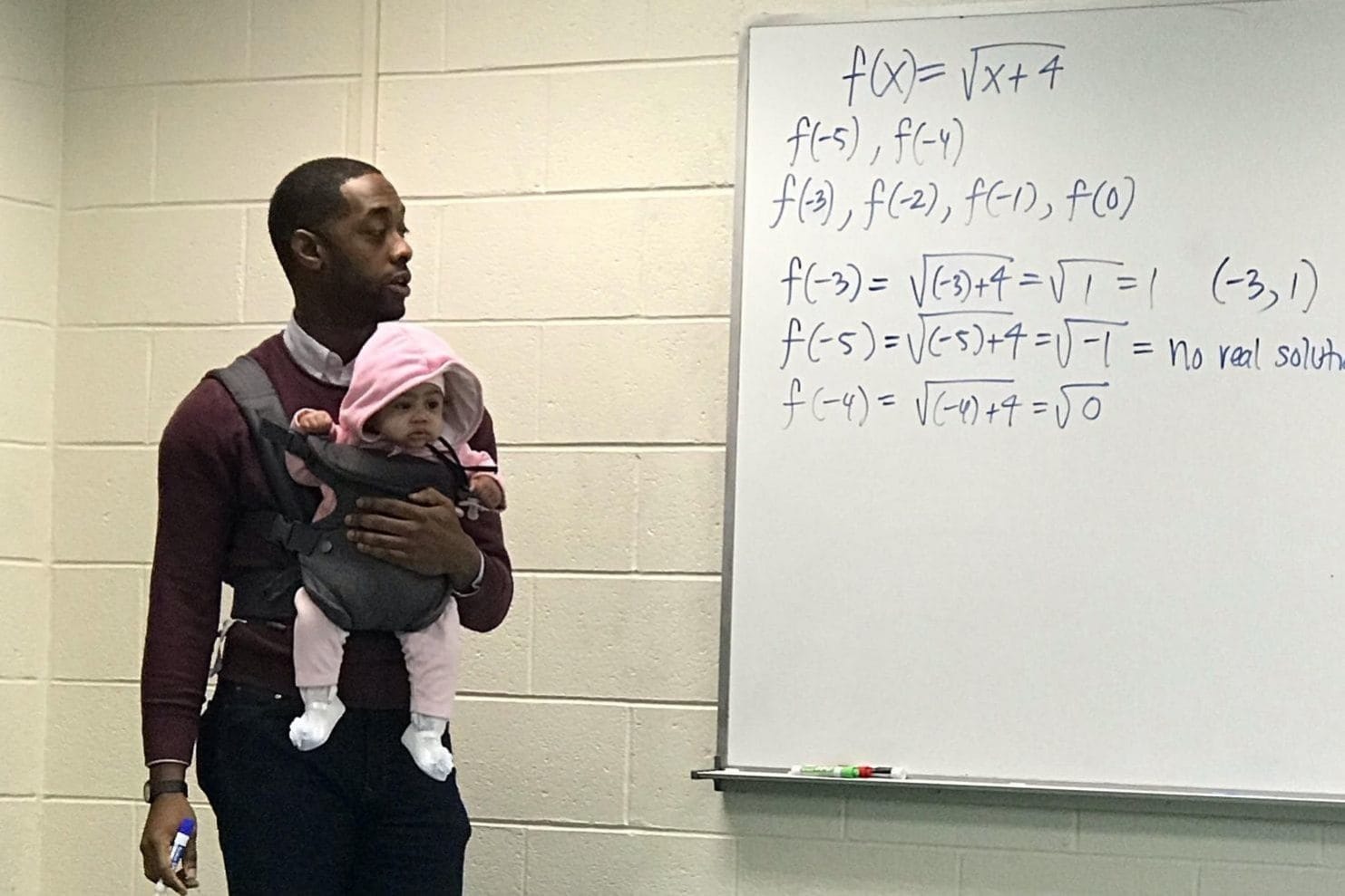 Our hero: This professor holding a baby for a student who didn’t have childcare