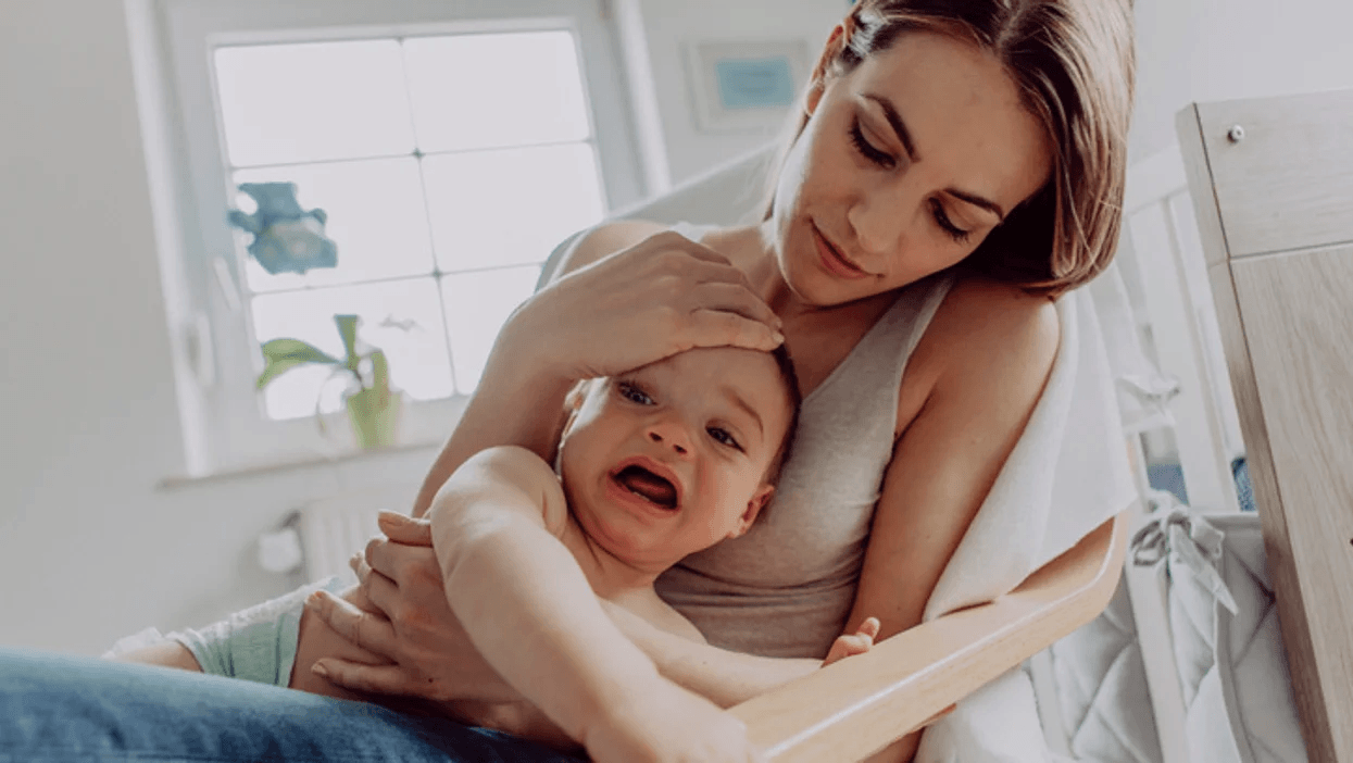 My child isn’t giving me a hard time—he’s *having* a hard time mom comforting upset child