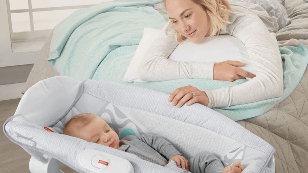 Why Consumer Reports wants the Rock ‘n Play recalled baby in a rock n play with mom overlooking