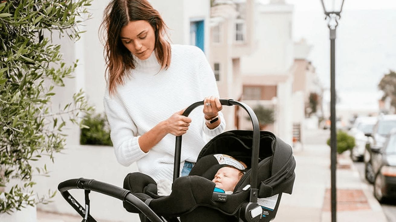 Rock your first year with baby with these 7 products & services 💪 mom carrying a baby in a carseat
