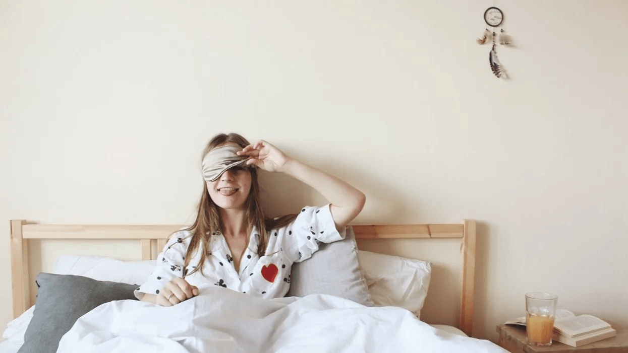 Trying to conceive? 9 most-asked questions, answered woman wearing a sleep mask in bed