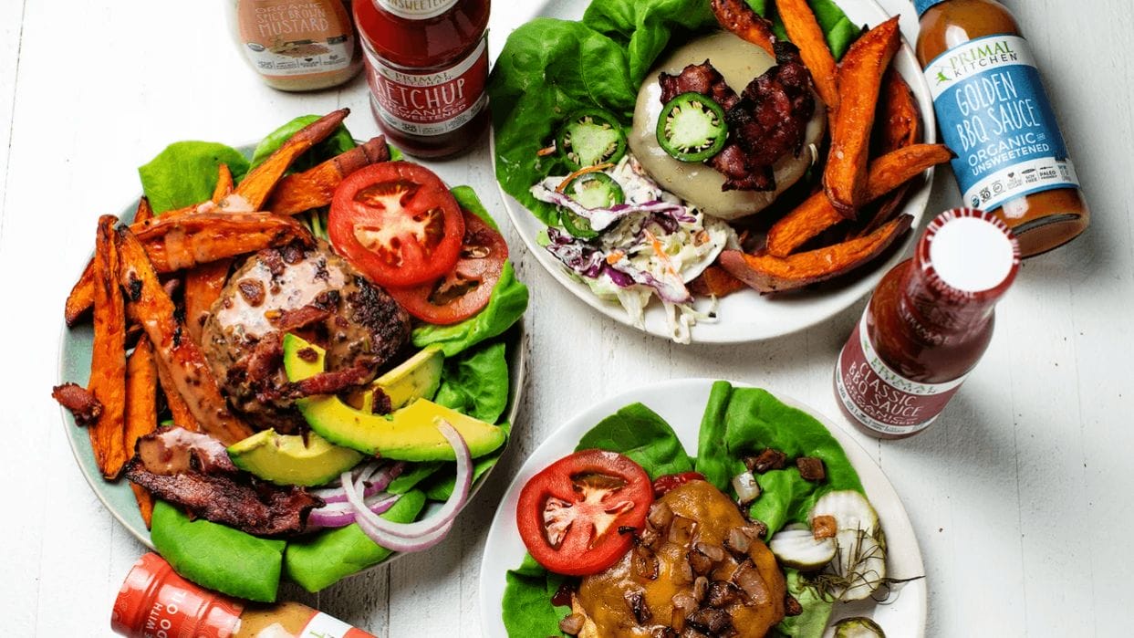I love grilling for my family in the summer—here’s how I keep meals healthy + kids happy aerial shot of 3 plates filled with grilled food