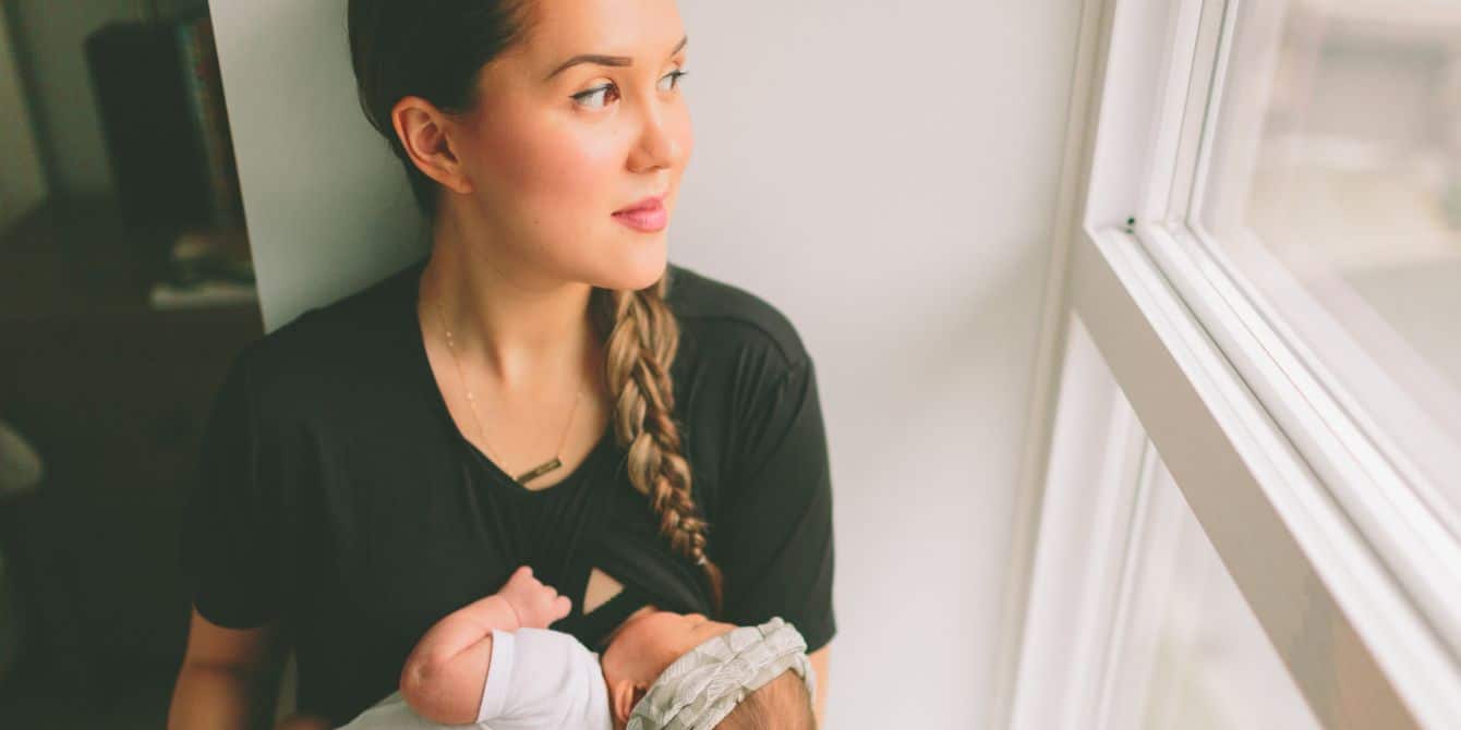 Newborns need care, but so do new mamas mother holding baby while feeding